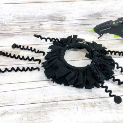 Attaching Pipe Cleaner Legs to Hoop
