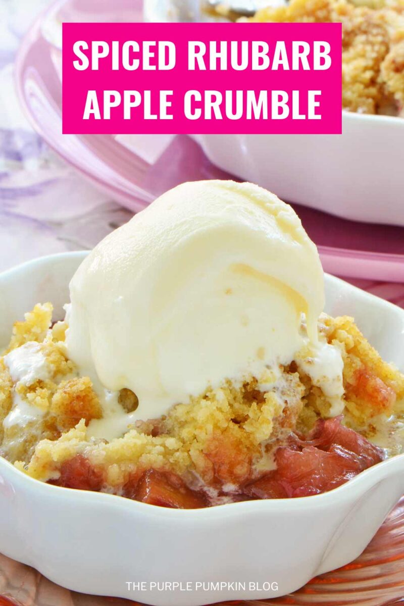 A white bowl filled with a portion of rhubarb apple crumble, topped with a scoop of vanilla ice cream. The text overlay says"Spiced Rhubarb Apple Crumble". Similar photos of the recipe from various angles are used throughout with different text overlays unless otherwise described.