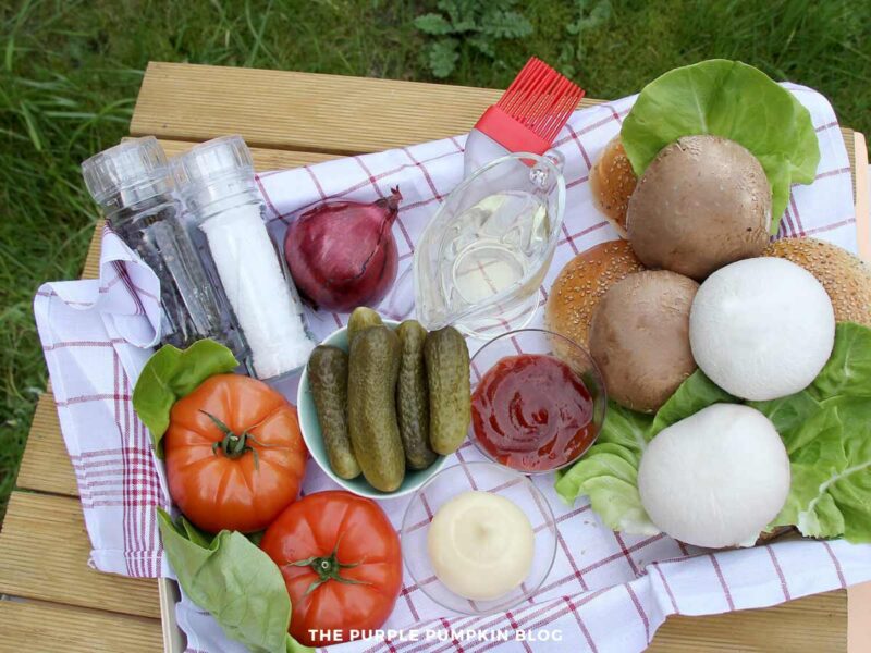 Ingredients for Grilled Mushroom Burgers - burger buns, mushrooms, lettuce, tomatoes, red onion, pickles, salt and pepper, BBQ sauce