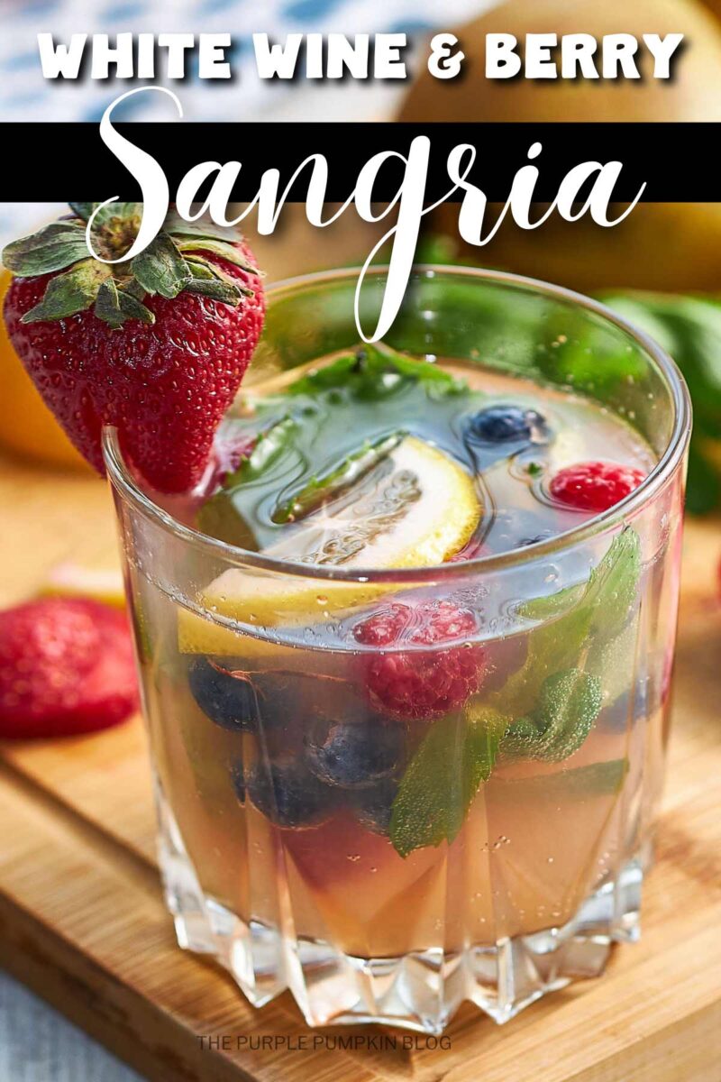 A glass filled white wine sangria with berries, lemon slices, and mint floating in the liquid. The text overlay says "White Wine & Berry Sangria". Images of the same cocktail feature throughout with different text overlays unless otherwise described.