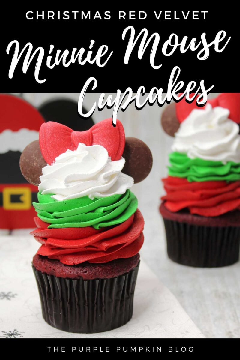 Red velvet cupcakes topped with a swirl of red frosting, topped with a swirl of green frosting, topped with a swirl of white frosting. A red fondant bow sits on top of the stack of tricolor frosting, with 2 round chocolate wafers either side to resemble Minnie Mouse's ears.
