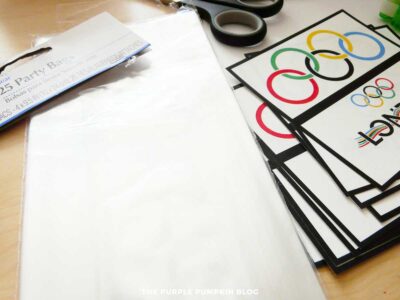 Plastic party bags, printed labels and scissors.