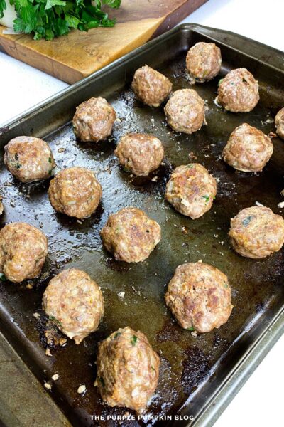 Part-Cooked Meatballs on Baking Sheet