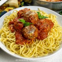 A bowl of spaghetti with meatballs.