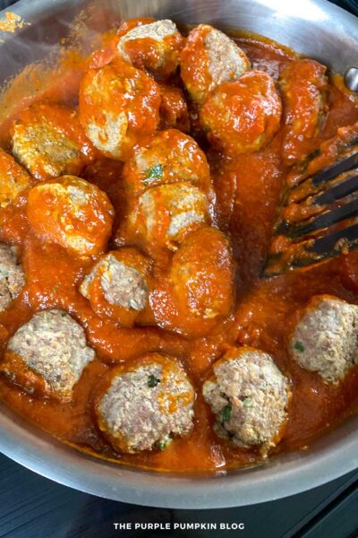 Tossing Meatballs in Marinara Sauce