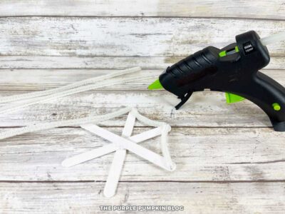 Adding White Pipe Cleaners to Craft Stick Web Base