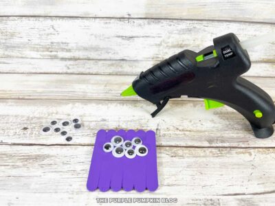 Attaching Eyes to Craft Stick Spider