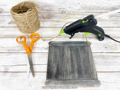 Attaching Ribbon to Halloween Craft Stick Sign