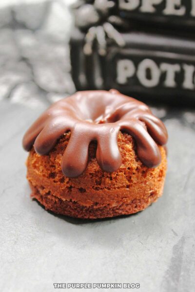 Mini chocolate bundt cake with chocolate ganache dripped on top.
