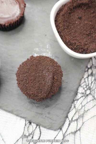 Chocolate Mini Cheesecakes covered with crushed chocolate cookies.