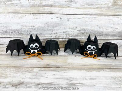 Handmade egg carton bats with Halloween decor.