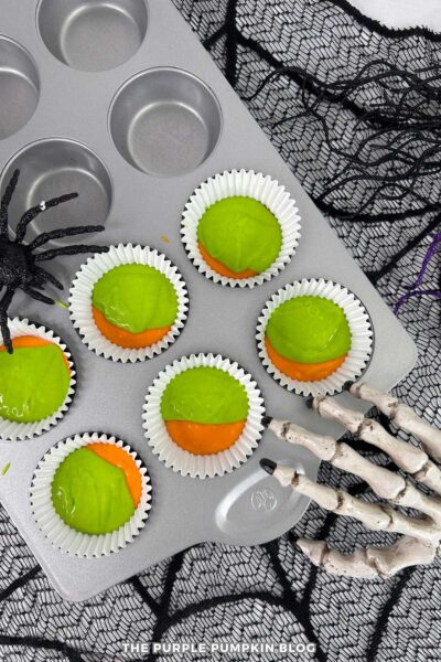 Green Cupcake Batter Added to Cupcake Liners