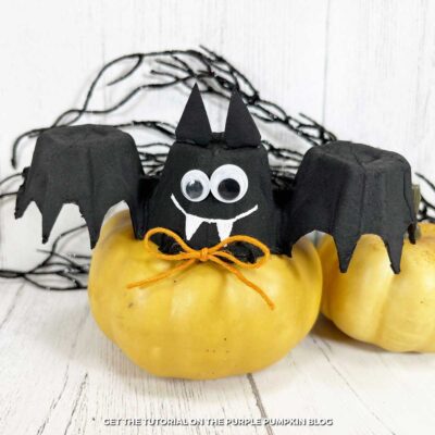 Handmade egg carton bats with Halloween decor.