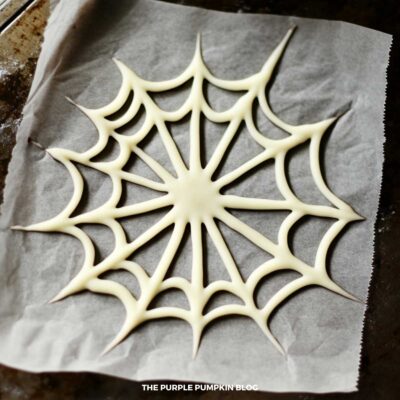 Illustrative Purposes - White Chocolate Spider Web on parchment paper