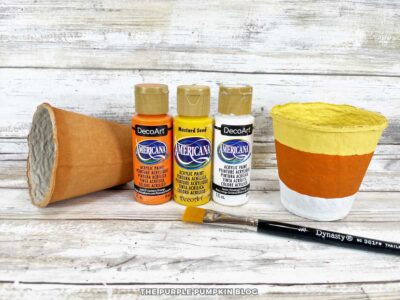 Painting Candy Corn Stripes onto Pots