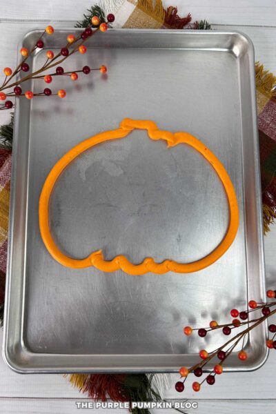Pumpkin Shape Frosting Outline on Serving Tray