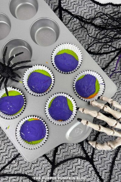 Purple Cupcake Batter Added to Cupcake Liners