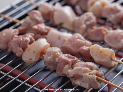Greek souvlaki skewers grilling on BBQ grill