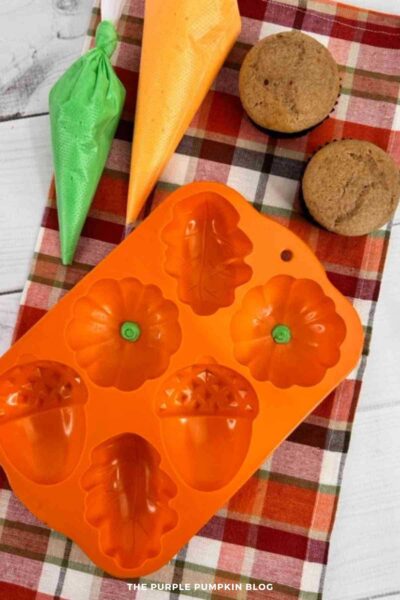 Green Frosting Piped into Pumpkin Silicone Mold