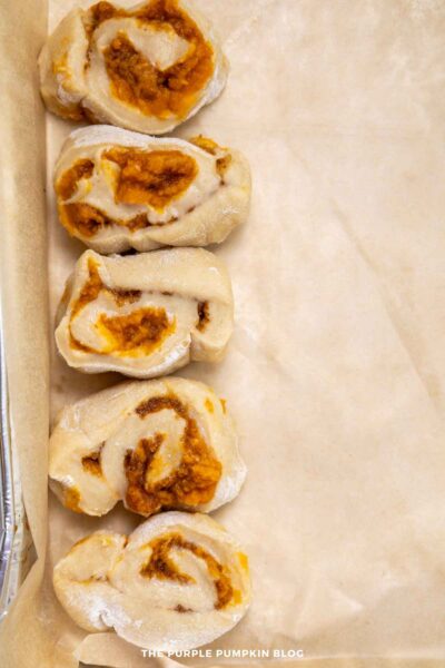 Pumpkin cinnamon roll-ups baked with sweet filling, ideal for fall baking recipes.