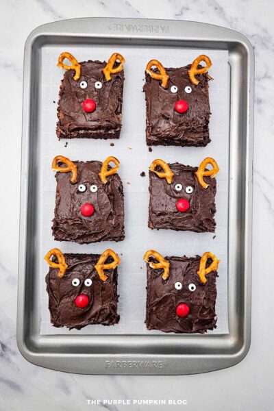 Adding Candy Noses to Reindeer Brownies