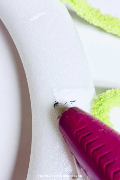Adding Hot Glue to Wreath Form