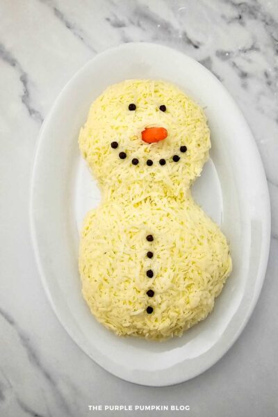 Carrot Stick & Peppercorns To Make Snowman's Features