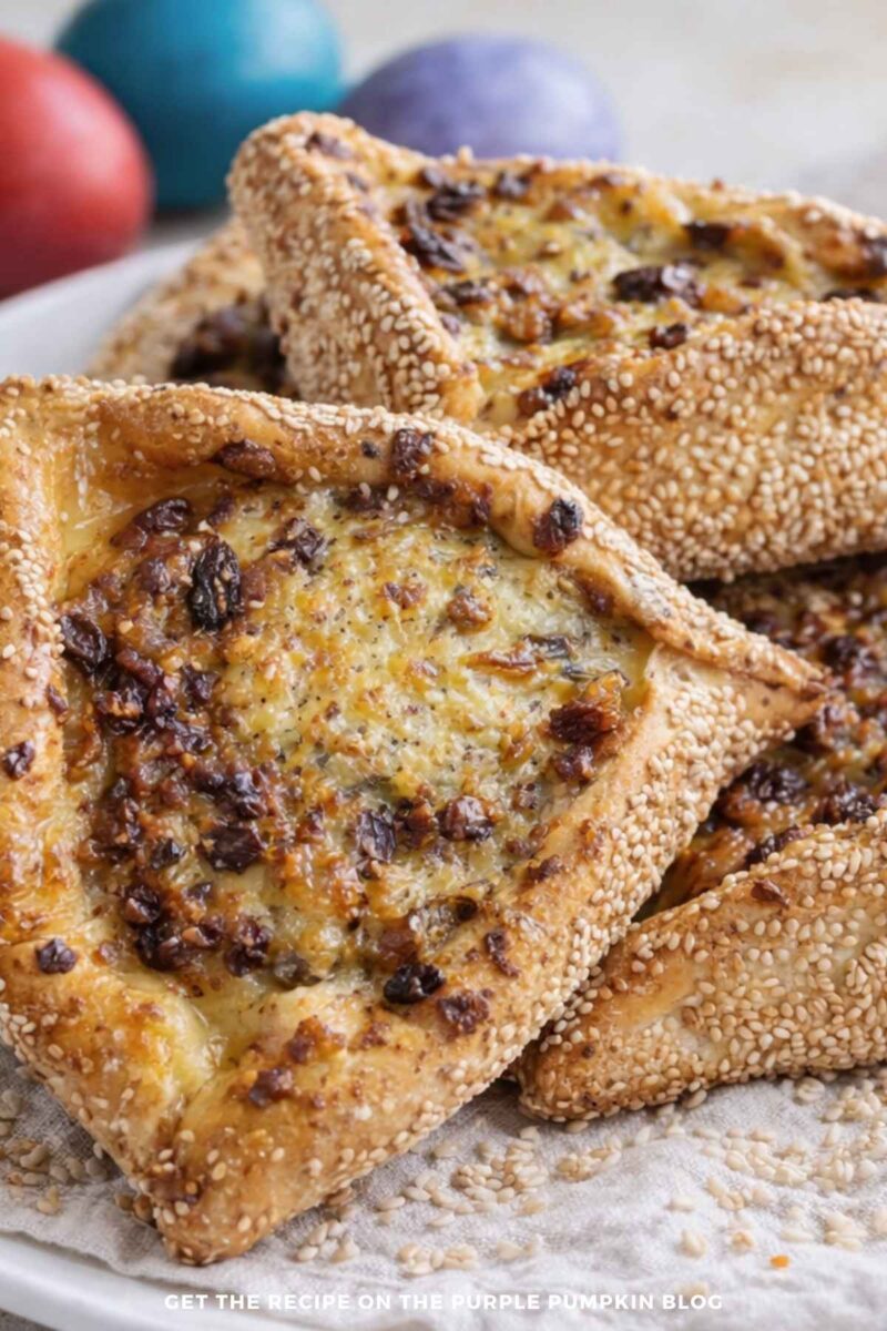 Cheese-filled pastry triangles with sesame seeds.