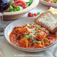 Italian Sausage Tomato Tortellini: Cheese tortellini with Italian sausage in a rich tomato sauce, topped with grated cheese and fresh basil.
