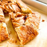 Pear Galette: Rustic pear galette with cinnamon-spiced sliced pears wrapped in golden pastry and sprinkled with coarse sugar.