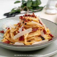 Pumpkin Bacon Linguine: Creamy pumpkin linguine topped with crispy bacon, shaved Parmesan, black pepper, and herbs.